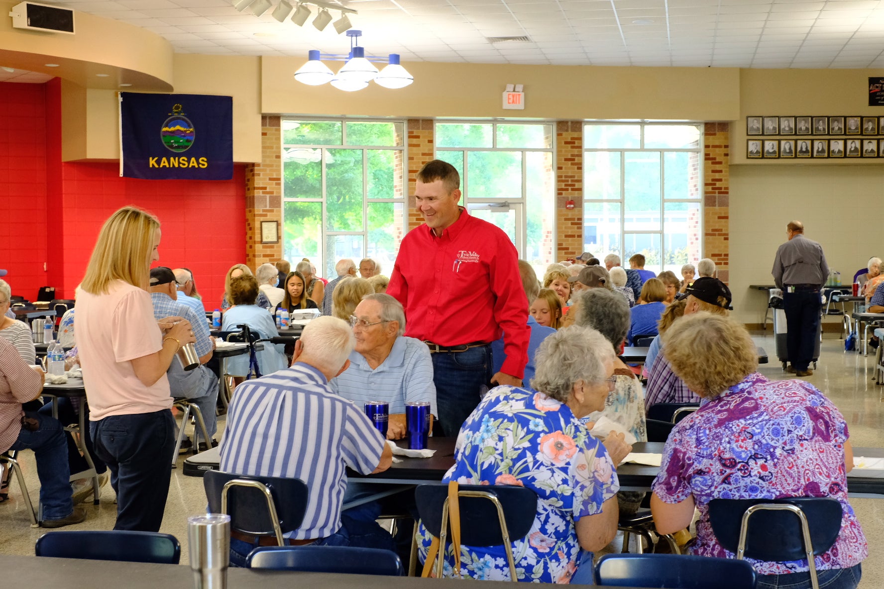 Twin Valley Electric Cooperative trustee Jared Nash speaks with members at the annual meeting